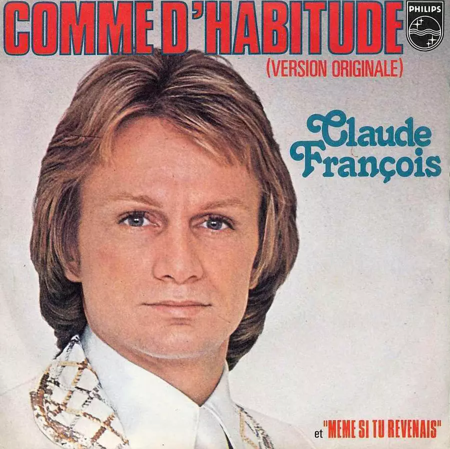 Gros plan sur Claude Francois en costume blanc